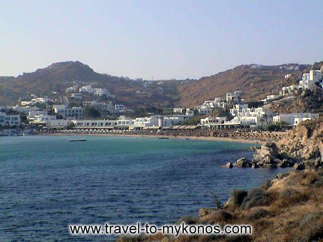 PLATYS GIALOS BEACH - Platis Gialos, a long golden sand beach thath attracts many tourists. by Alexandros Damigos