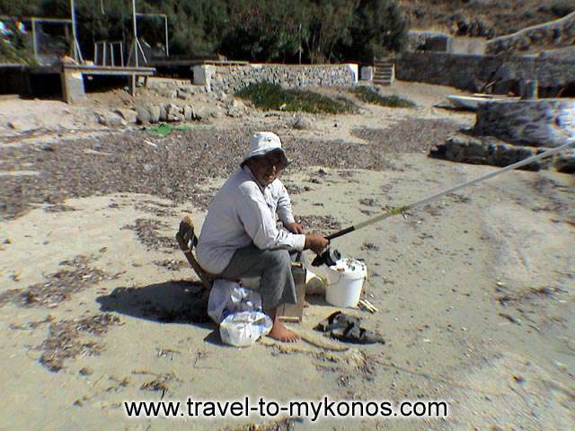 ORNOS BEACH - A fisherman on the work...