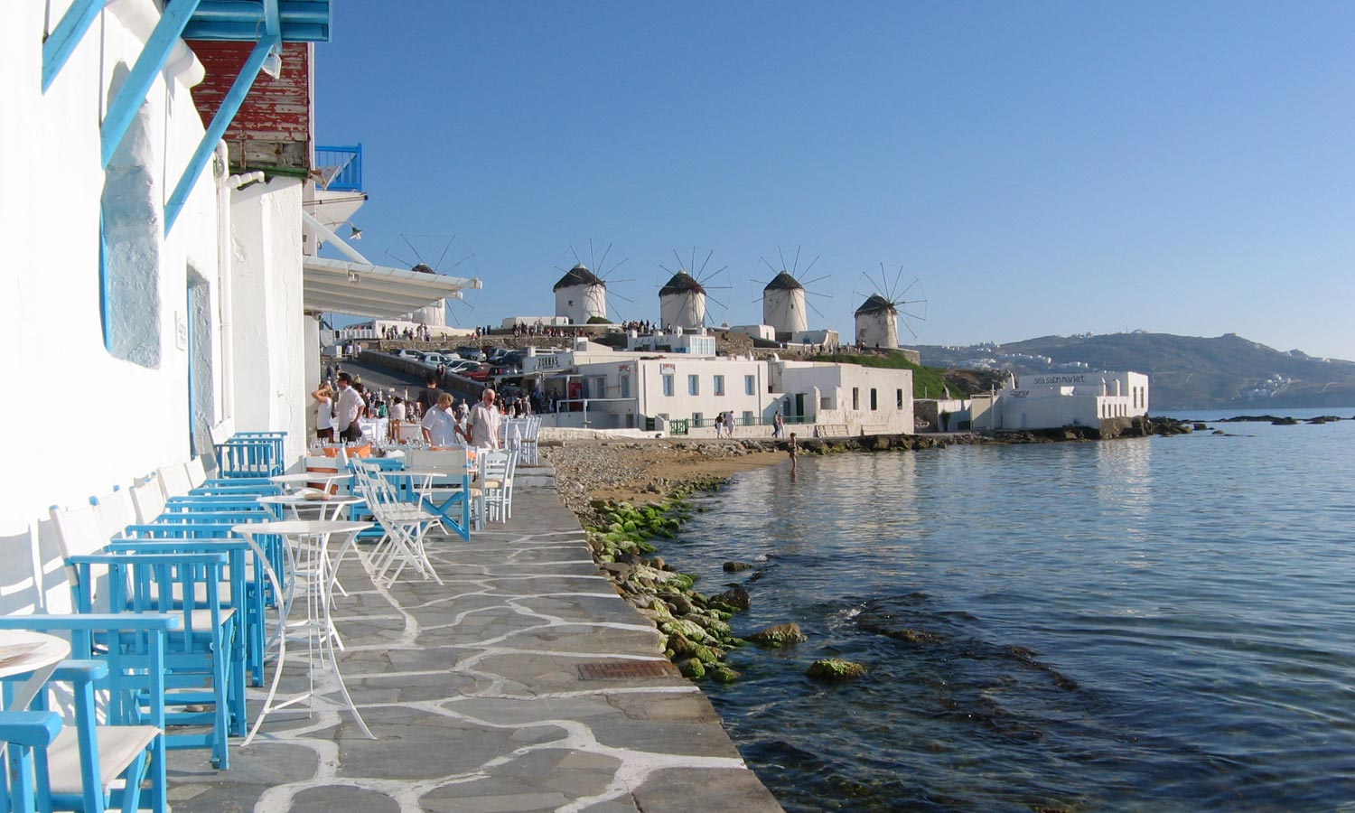 View of the famous Mykonos windmills from Little Venice MYKONOS PHOTO GALLERY - Little Venice