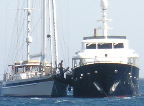 The superyacht pictured here in Mykonos sails at anchor badly anyway, but when its skipper didn’t put out enough chain in 35 knots of wind on Sunday, she lost control altogether. <br><br>

First, with no-one on deck, she was drifting out to sea in the high wind at great speed. Then, as her anchor caught inadvertently right next to a much smaller sailing yacht, she sailed, still with no-one on deck, straight into the sailing yacht. <br><br>

We watched, helpless but with a fascinated horror, as the crew of the sailing yacht shouted over the wind, ran for fenders and got their entire crew on deck. Finally, just before the collision, bodies started to appear on the bigger motoryacht, but too late, too late, too late…. <br><br>

More on <a href=http://www.sail-world.com/index.cfm?Nid=25624 target=_blank>Sail world</a>